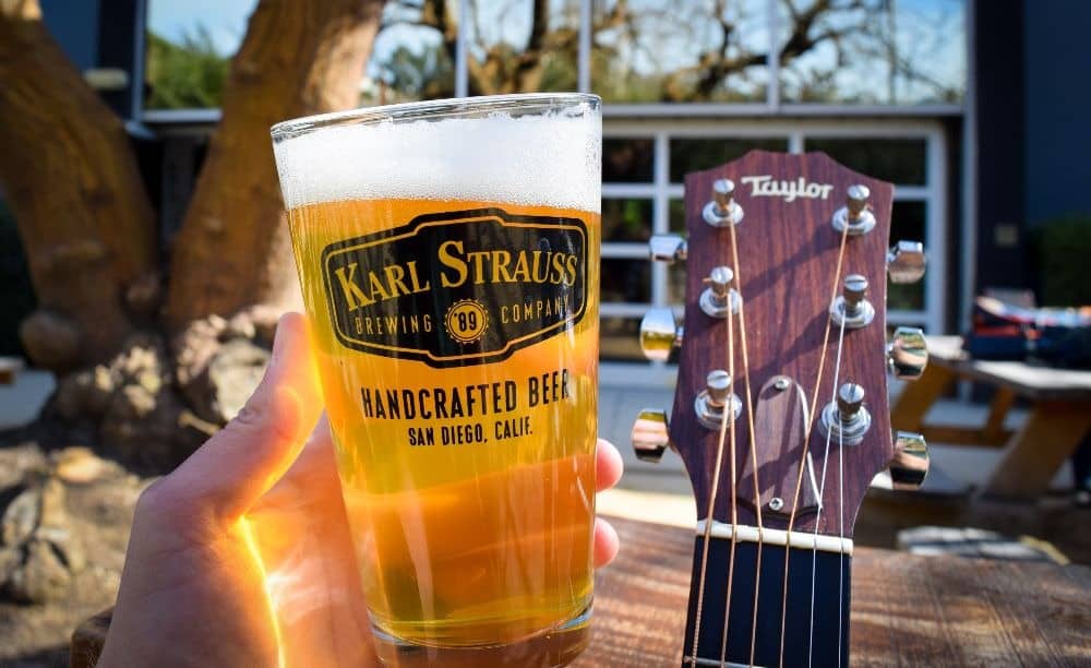 Beer in pint glass, guitar in background